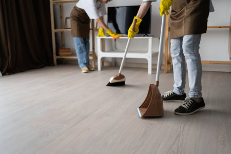Two female janitors home office clean, cleaning service, professional housekeeping.の写真素材