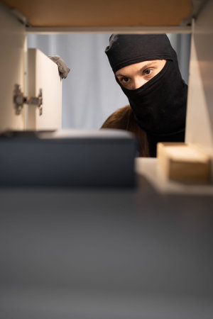 Female thief searching money stealing house. Criminal, house crime and breaking. Apartment, robbery...