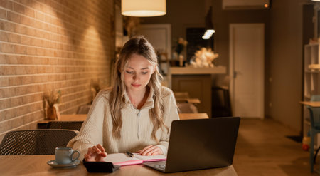businesswoman or female accountant calculate monthly expenses using calculator and laptop, checking...