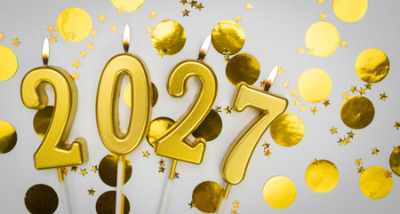 New Year greeting card. background Happy New Year 2027. Golden candles with numbers of year 2027 on festive decor background.の写真素材