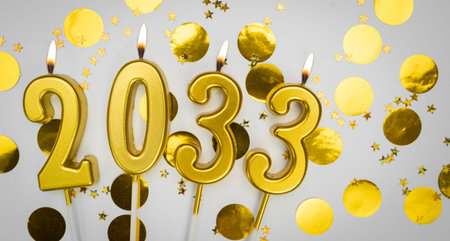 New Year greeting card. background Happy New Year 2033. Golden candles with numbers of year 2033 on festive decor background.の写真素材