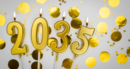 New Year greeting card. background Happy New Year 2035. Golden candles with numbers of year 2035 on festive decor background.の写真素材