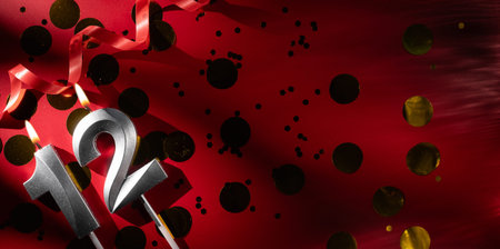 Concept of celebrating birthday and anniversary. Number 12 twelve silver celebration birthday candle...
