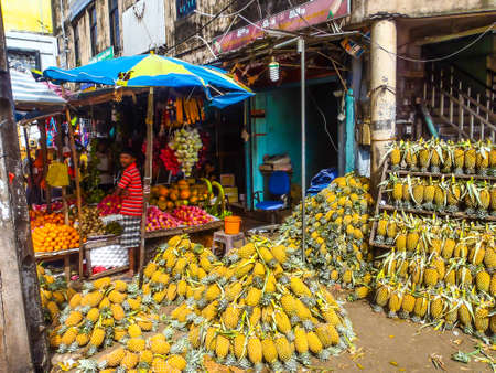 View of a fruit market with large quantities of pineapple in Galleのeditorial素材