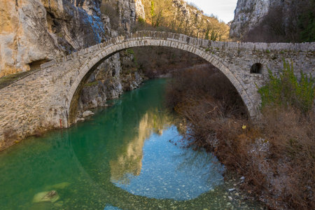Kokori's old one-arch stone bridge (Noutsos) situated on the river of Voidomatis in the municipality...