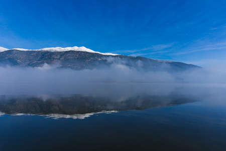 Misty lake of Ioannina (Pamvotis) in the morning in Greeceの写真素材