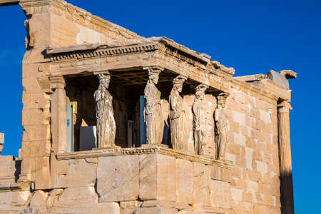 The Caryatids of the Erechtheion in Acropolis Athens Greece. A caryatid is a sculpted female figure serving as an architectural support taking the place of a column or a pillar supporting an entablature on her headの写真素材