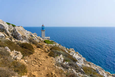 Lighthouse at cape Tainaron lighthouse in Mani Greece. Cape Tenaro, (Cape Matapan) is the southernmost point of mainland Greece. Situated at the end of Mani, in the Peloponnese and it separates the Messenian Gulf in the west from the Laconian Gulf in the eastの写真素材