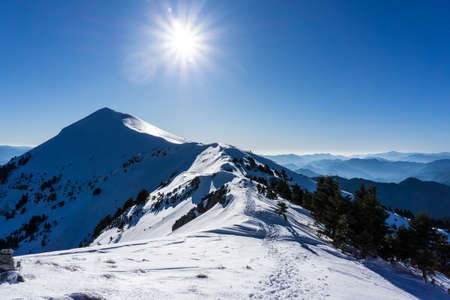 Summit of Dourdouvana snow covered mountain in Peloponnese Greeceの写真素材