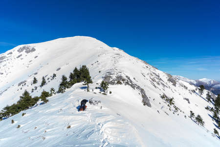 Summit of Dourdouvana snow covered mountain in Peloponnese Greeceの写真素材