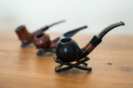 Close up of a smoking pipes in a rowの写真素材
