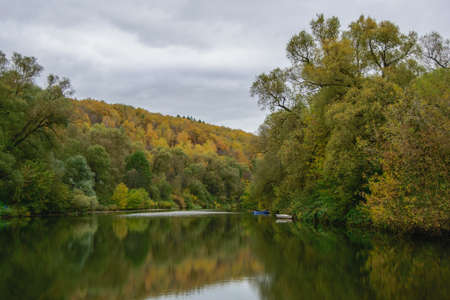 Autumn Landscape with a view of the calm river with high banksの写真素材