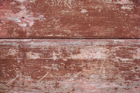 texture of old boards with remnants of brown paintの写真素材