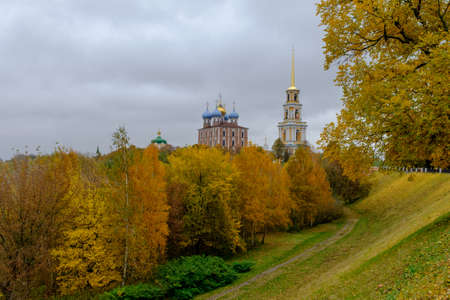 autumn landscape with a view of the Orthodox churches on a background of yellow foliageの写真素材