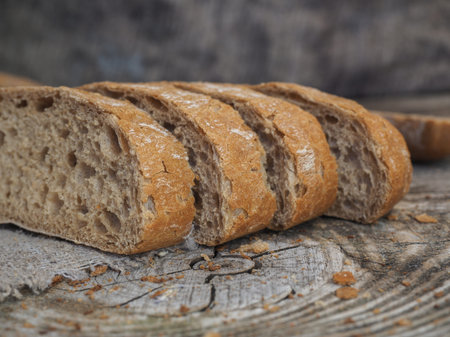 chiabatta bread of rye and wheat flour on a wooden table of old boards