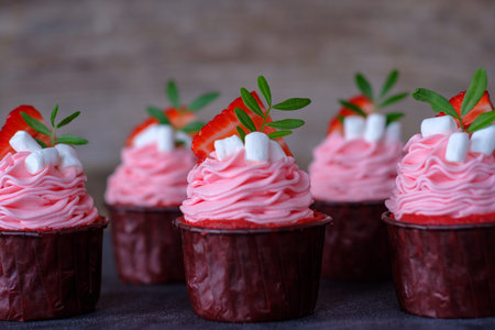 beautiful wedding cupcakes with white pink cream and strawberries