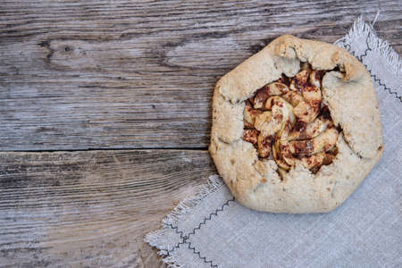 homemade biscuits with apples and cinnamon on wooden backgroundの写真素材