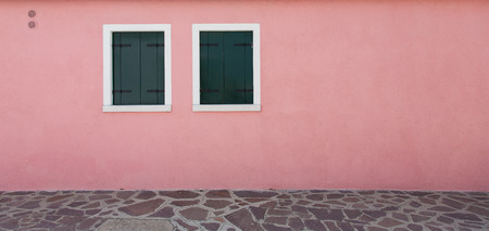Pink wall and two windowの写真素材