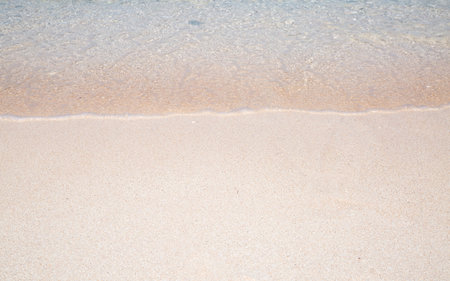 Wave of the sea on the sand beach in Guam