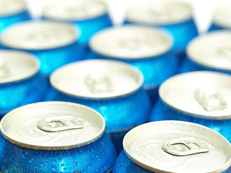 Soda or beer cans straight from the fridge.  Shallow DOF, focus on the first 2 cansの写真素材