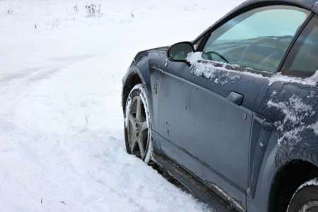Unrecognizeable car stuck in the snowfieldの写真素材