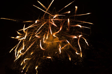 Celebration and holidays concept. Abstract background with fireworks explosions, fire tongues are...