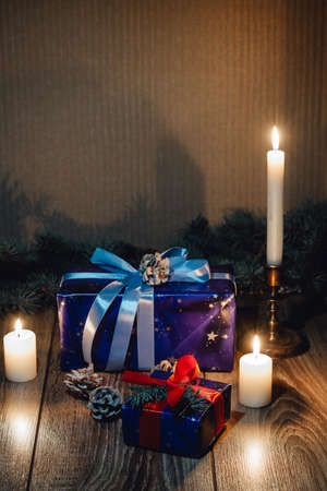 New Year composition View from above. Herringbone toys with candles, boxes on wooden background, with space for textの写真素材