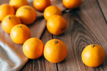 Bio bloody oranges and lemons in the basket on rustic wooden board, cut in halves. Top Viewの写真素材