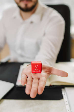 Business man in white shirt is preparing a gift for women employeesの写真素材