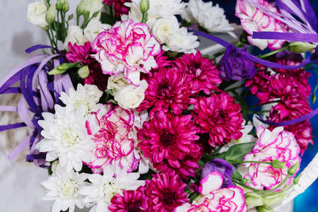 White daisies in a wooden basket, decoration for a weddingの写真素材