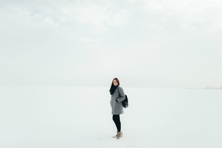 Girl in the winter forest, far view