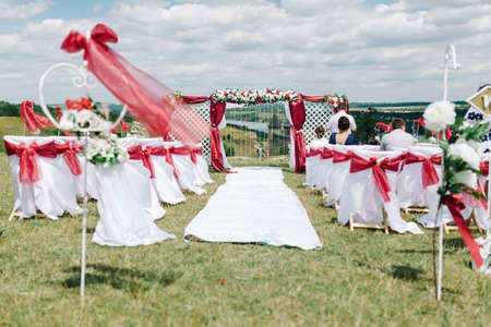 Wedding decor. Wooden plaque with the inscription Wedding. Wedding on a plate green background and a fountain. Wedding decorations,の写真素材