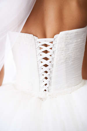 Young attractive bride in white beautiful wedding dress. Wedding concept, back viewの写真素材