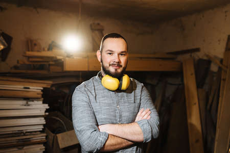 Carpenter in the workshop working with woodの写真素材