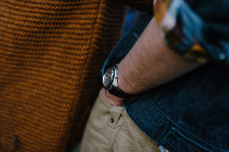 Hand of a man in a pocket, on his hand watchの写真素材