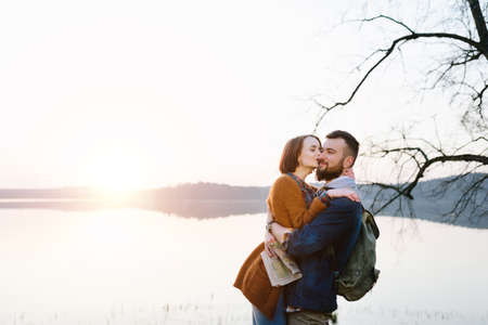 Happy couple on vacation hiking in the mountains with a mapの写真素材