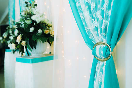 Decoration of wedding flowers in a restaurant, in white blue tonesの写真素材