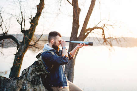A guy with a telescope for nature...の写真素材