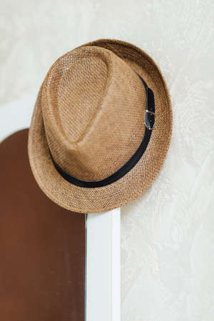 Brown color hat for the groom with a black strap accessoryの写真素材