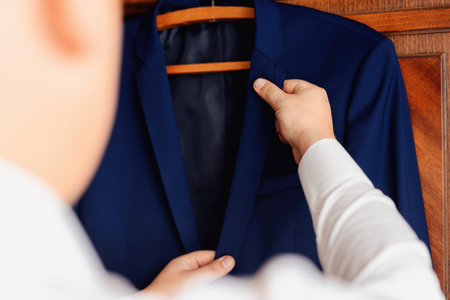 business man touching his jacket. Closeup portrait of a businessman selective focus.
