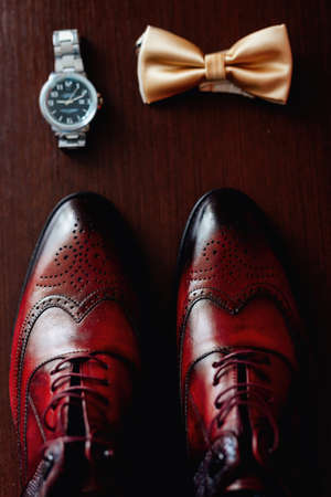 Groom Set Butterfly Shoes Watch Men's Accessories, on a wooden backgroundの写真素材