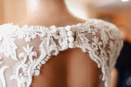Beautiful wedding dresses on a mannequin, details close-upの写真素材