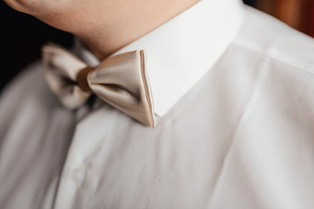 red and beige butterflies for the wedding, on a wooden background, for the groom and the mastersの写真素材