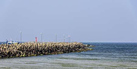 Breakwater Mole fishing boatの写真素材