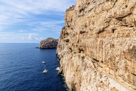 Rock wall staircase Grotta di Nettuno Sardiniaの写真素材