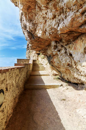 Path rock face Grotta di Nettuno Sardiniaの写真素材