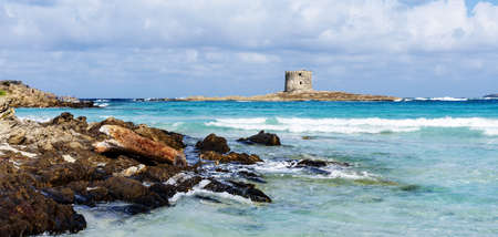 Spiagga della Pelosetta beach Torre della Pelosa defense towerの写真素材