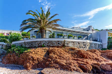 Vacation house rocks Mediterranean coast Palm tree architectureのeditorial素材