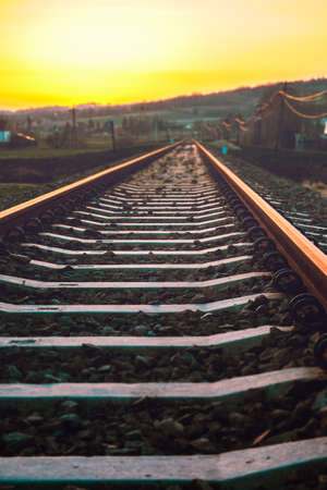 railroad tracks through the village in the mountainsの写真素材