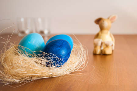 Blue Easter eggs and Easter bunnyの写真素材